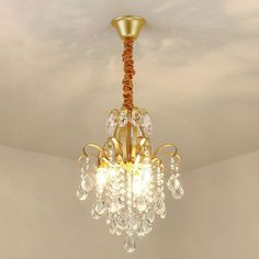 a gold chandelier hanging from the ceiling