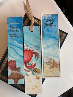 three bookmarks with sea creatures on them