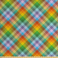 an orange, green and blue plaid pattern with a ruler in front of the image