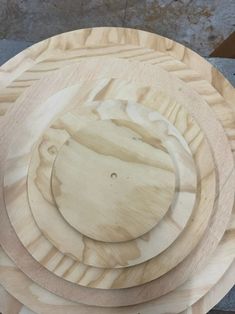 three wooden plates stacked on top of each other in the shape of an animal's head