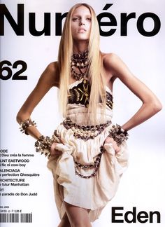 the cover of numero magazine featuring a woman in a short dress and necklaces