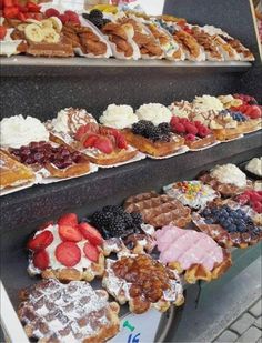 many different types of pastries are on display