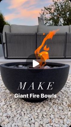 a fire bowl with the words make giant fire bowls on it and an orange flame