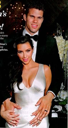 a man and woman on the cover of people magazine, posing for a photo with their arms around each other