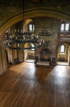 the inside of an old building with wood flooring and arched windows stock photos - image