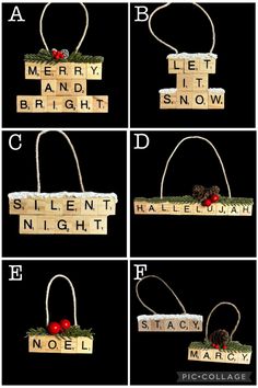 four different wooden blocks with words written on them and christmas decorations hanging from the top