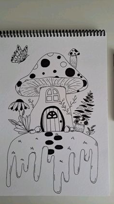 a drawing of a mushroom house on top of a table