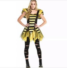 a woman in a bee costume posing for the camera with her hands on her hips