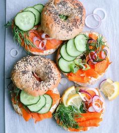 bagel sandwiches with salmon, cucumbers and onions