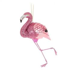 a pink flamingo christmas ornament hanging from a chain on a white background