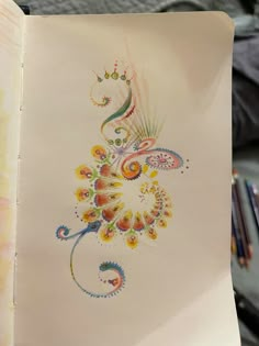 an open book with colorful designs on it