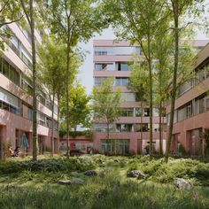 an apartment building surrounded by trees and grass