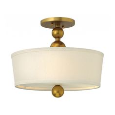 a light fixture with a white shade on it