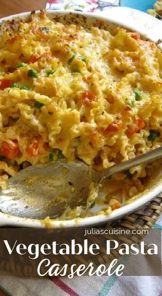 a casserole dish is shown with a spoon in it and the words, vegetable pasta casserole