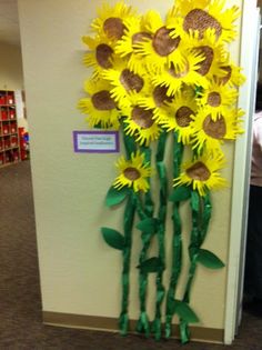 a bunch of fake sunflowers are in front of a door with the caption pinterest the world's catalogue of ideas