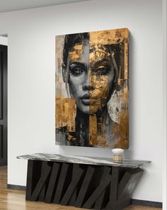 a large painting on the wall above a console in a room with wooden floors and white walls