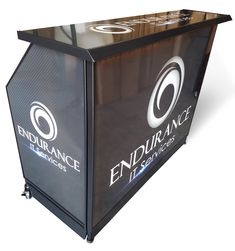 the endurance it services counter is black with silver letters and an oval logo