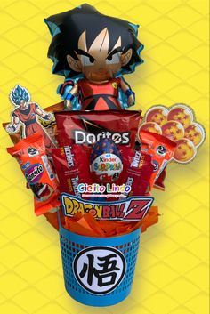 the dragon ball candy bouquet is in a blue cup