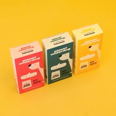 three boxes with different types of condoms in them on a yellow background, one is empty and the other two are closed