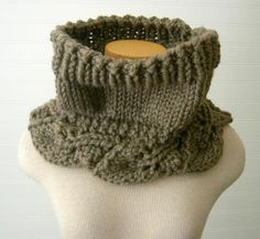 a knitted cowl on top of a mannequin's headpiece