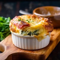 a close up of a casserole on a cutting board with other food items