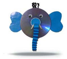 an elephant made out of cds with a blue stripe on it's tail and eyes