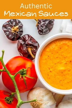 a bowl of mexican sauce surrounded by tomatoes and garlic