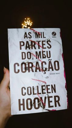 a person holding up a book with writing on it in spanish and english, which reads as mll parties do meu corago