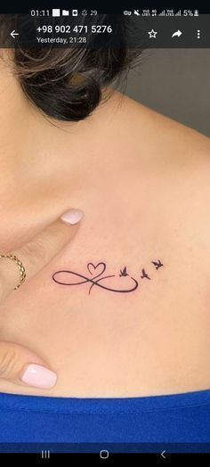 a woman's stomach with the word love tattooed on her left side breast piece