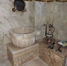 a bathroom with marble walls and flooring