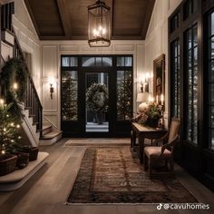 the entryway is decorated for christmas with wreaths and lights