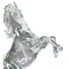 a glass figurine of a horse on its hind legs