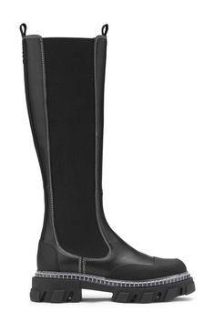 The Cleated High Chelsea Boots feature elastic panels, toe cap details, pull tabs, contrast stitching, chunky cleated soles and a subtle GANNI logo. GANNI Cleated High Chelsea Boots in Black | Women's Size 9 | Calf Leather/Leather High Chelsea Boots Outfit, High Chelsea Boots, Chelsea Boots Outfit, Black Chelsea Boots, Chelsea Boot, Boots Outfit, All About Fashion, Rubber Rain Boots, Calf Leather