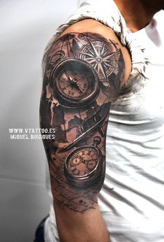 a man with a clock and compass tattoo on his arm