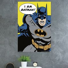 a batman comic poster hanging on the wall