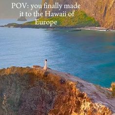 a man standing on top of a cliff next to the ocean with a caption that reads pov you finally made it to the hawaiian of europe