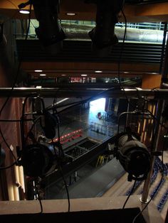 an overhead view of a stage with headphones hanging from the ceiling and lights on