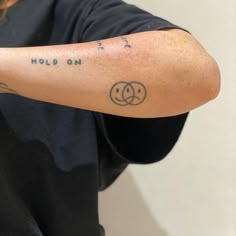 a person with a tattoo on their arm