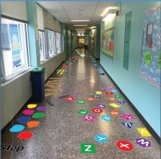 the hallway is decorated with colorful stickers on the floor