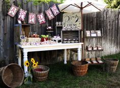 an outdoor farmers market selling fresh produce