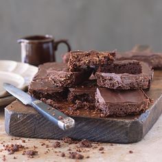 chocolate brownies on a cutting board with a knife