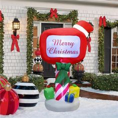 an inflatable christmas sign with presents on it