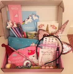 a pink box filled with lots of different items