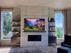 a large flat screen tv mounted to the side of a wall in a living room