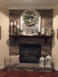 a fireplace with a wreath on the mantle