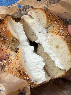 a bagel with cream cheese and sesame seeds