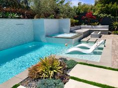 an outdoor swimming pool with artificial grass