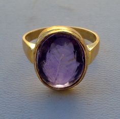 Vintage 18k solid gold ring from Rajasthan India. Beautiful design seted amethyst gemstone. Nice handmade molded ring made of 18k solid yellow gold, Good for your jewellery collection.Usa ring size - 8 (we can adjust the size)width of top - 1.5 cm Weight - 6.7 gramsMaterial - 18k solid gold. Gold Amethyst Ring With Hallmark, Handmade Amethyst Ring In Yellow Gold, Handmade Gold Oval Amethyst Ring, Handmade Gold Amethyst Ring For Formal Occasions, Gold Amethyst Ring With Bezel Setting, Unusual Jewelry, 18k Gold Ring, Funky Jewelry, Rajasthan India