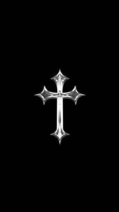 a silver cross on a black background