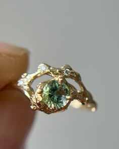 Olivia Ewing Jewelry on Instagram: “I love a ring with a special meaning… “Phenomenal Ring.. I absolutely love this ring! My long time girlfriend of 3 years and I met in Maine…” Angelite Ring, Odd Wedding Rings, Green Wedding Ring Aesthetic, Quirky Engagement Ring, Engagement Rings Natural, Wedding Rings Cottagecore, Earthy Wedding Rings Unique, Engagement Ring Whimsical, Alternative Engagement Rings Boho
